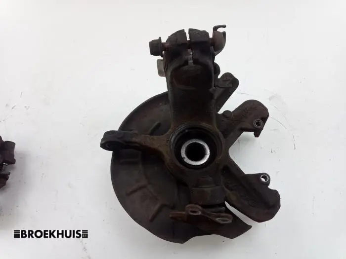 Knuckle, front left Skoda Fabia